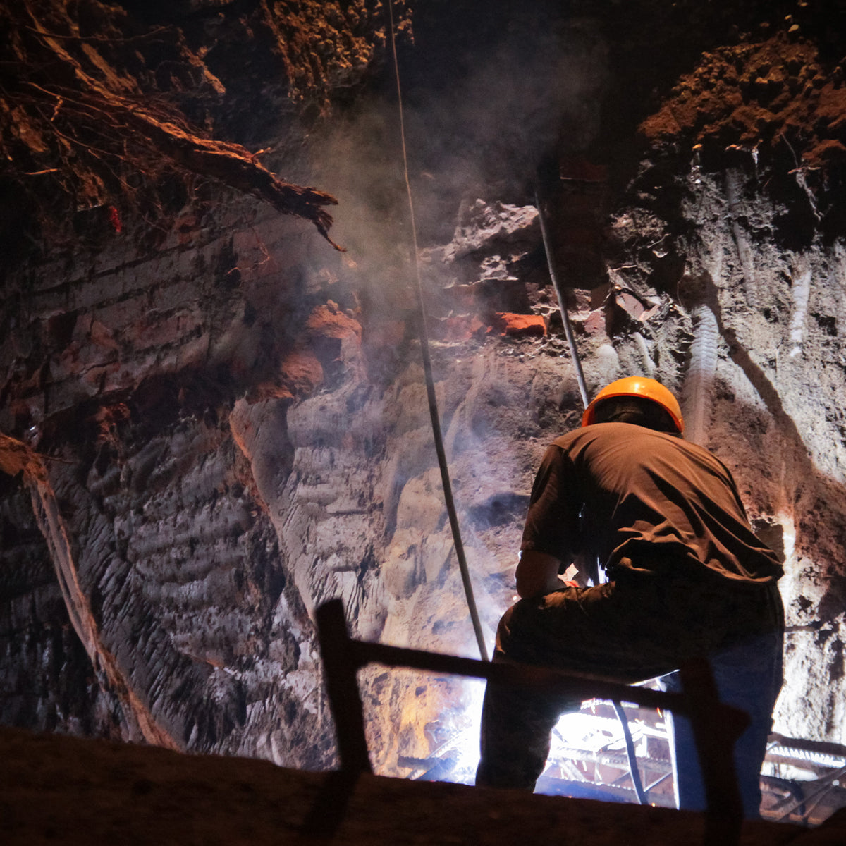 Man mining underground for precious gems.