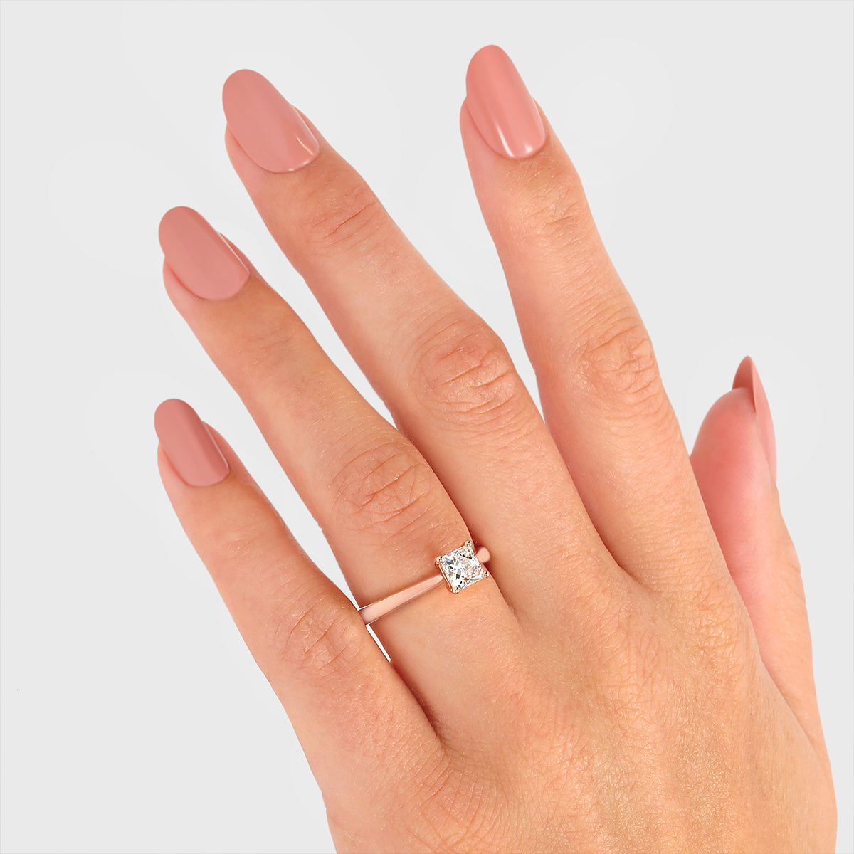 Hand wearing a Rose Gold Shimansky Diamond Engagement Ring