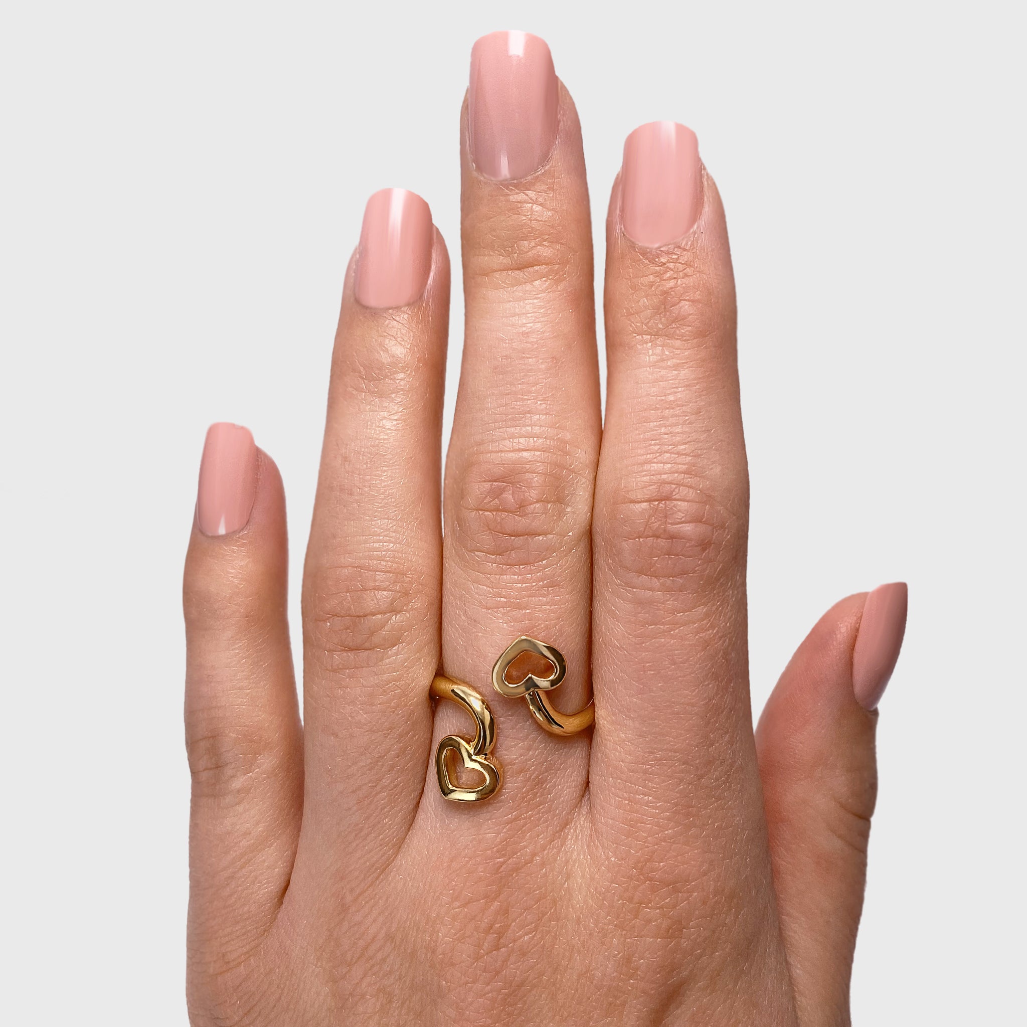 Shimansky - Women Wearing the Two Hearts Twist Ring Crafted in 18K Yellow Gold