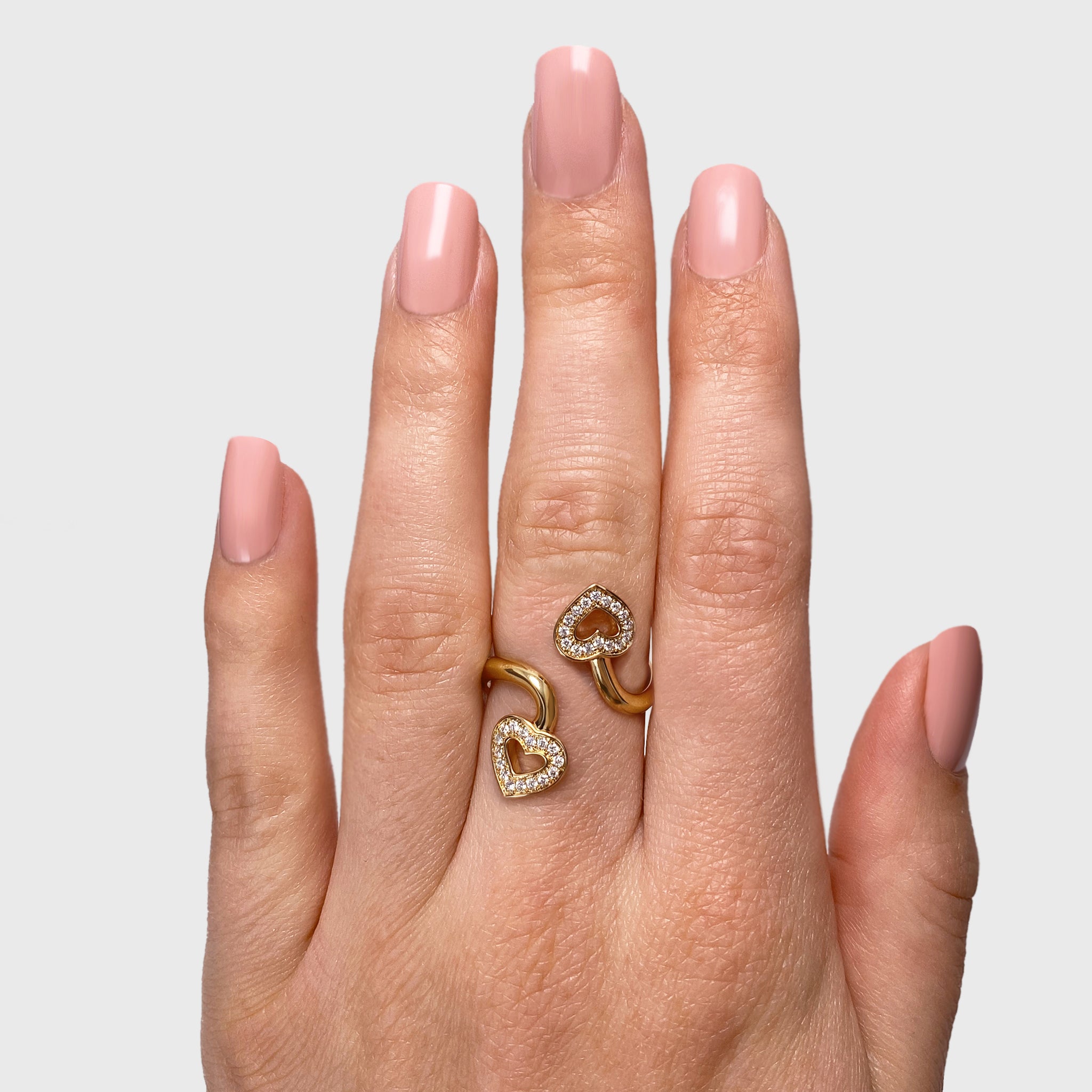 Shimansky - Women Wearing the Two Hearts Twist Diamond Pave Ring 0.20ct crafted in 18K Yellow Gold